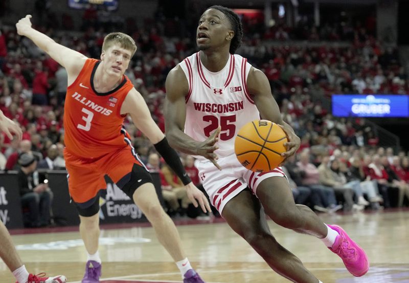 Wisconsin guard John Blackwell (25) drives past Illinois forward Ben Humrichous (3) during the second half of their game Tuesday, February 18, 2025 at the Kohl Center in Madison, Wisconsin. Wisconsin beat Illinois 95-74.