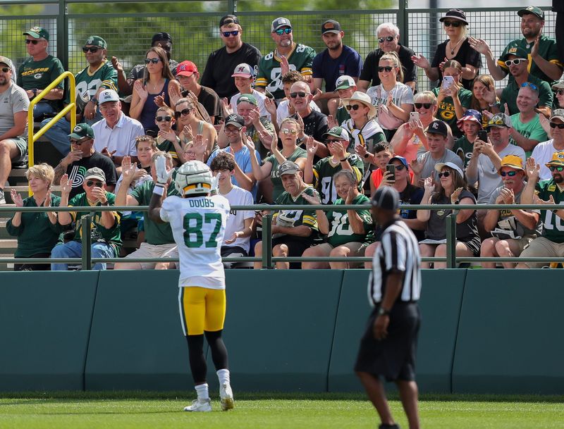 Green Bay Packers receiver Romeo Doubs pumps up the crowd during the 12th practice of training camp on Aug. 6 at Ray Nitschke Field in Ashwaubenon.