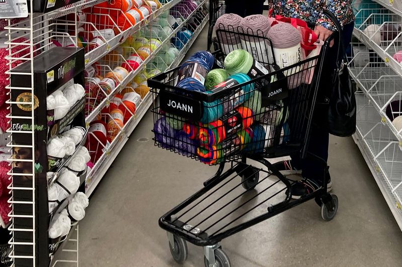 A shopping cart is filled with yarn to purchase at JOANN Fabric and Craft Store at 4950 South 74Th St in Greenfield on Tuesday Feb. 25, 2025. The retail chain shuttered all of its stores earlier this year.