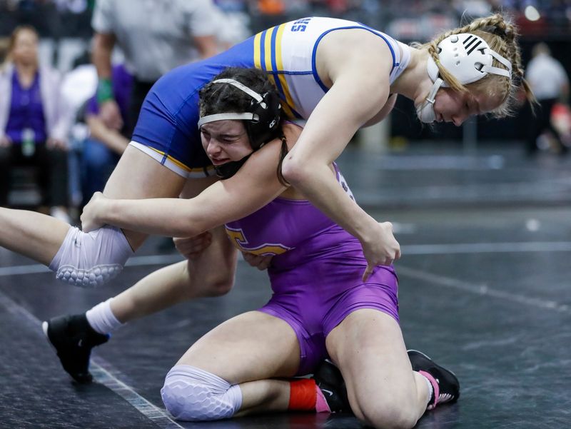 Two Rivers High School's Angie Bianchi takes a shot against Mukwonago High School's Cailyn Whittier in a girls 120-pound semifinal match during the WIAA state individual wrestling tournament on Friday, February 28, 2025, at the Kohl Center in Madison, Wis. 
Tork Mason/USA TODAY NETWORK-Wisconsin