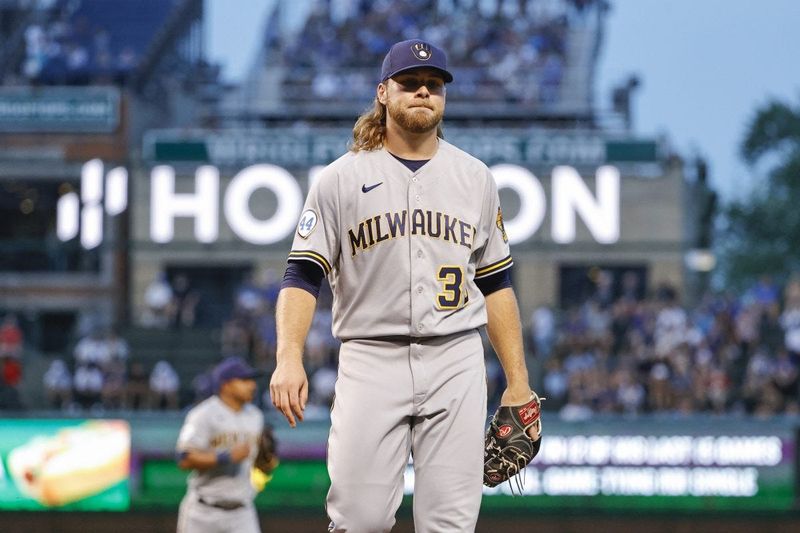 Aug 11, 2021; Chicago, Illinois, USA; Milwaukee Brewers starting pitcher Corbin Burnes (39) returns to the dugout after pitching against the Chicago Cubs during the first inning at Wrigley Field. Mandatory Credit: Kamil Krzaczynski-USA TODAY Sports