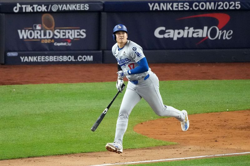 Oct 29, 2024; Bronx, New York, USA; Los Angeles Dodgers designated hitter Shohei Ohtani (17) hits into an out against the New York Yankees in the second inning during game four of the 2024 MLB World Series at Yankee Stadium. Mandatory Credit: Robert Deutsch-Imagn Images