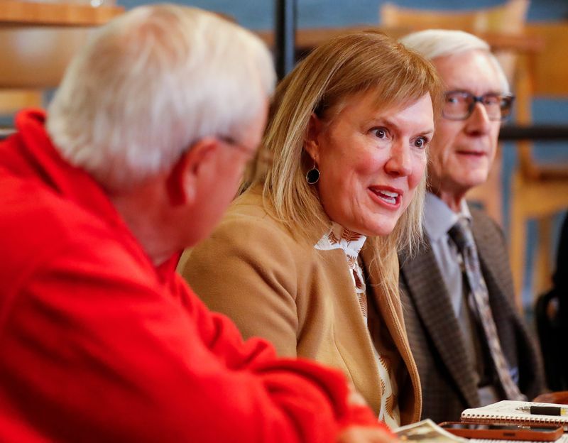 Wisconsin Department of Health Services Secretary Kirsten Johnson talks during a roundtable on Thursday, March 6, 2025, at Kavarna coffeehouse in Green Bay, Wis. Johnson and Gov. Tony Evers met with local officials and community members to discuss Evers’ budget plan to address insurance price gouging and overall health care costs.