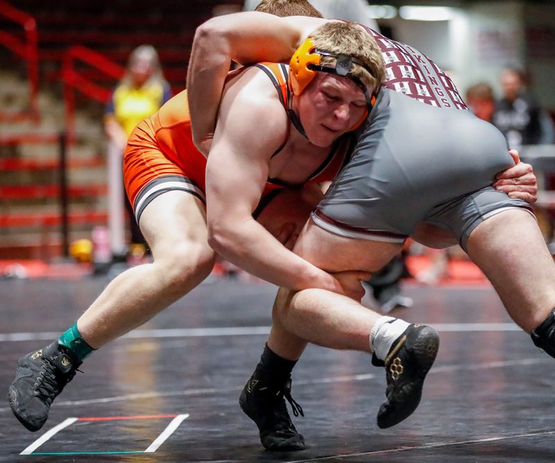 Kaukauna High School’s Zach Winnekens takes a shot against Holmen High School’s Abraham Henderson in a 215-pound match during a Division 1 semifinal dual in the WIAA state team wrestling tournament on Friday, March 7, 2025, at the Wisconsin Field House in Madison, Kaukauna won the dual, 40-22, to advance to Saturday’s championship dual.Wis.
Tork Mason/USA TODAY NETWORK-Wisconsin