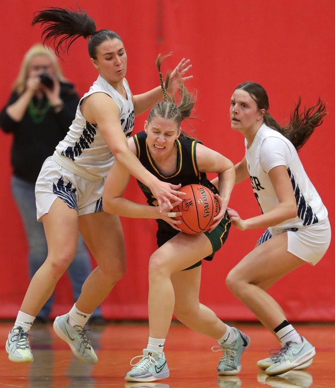 Wittenberg-Birnamwood’s Rory Salvensen (20) against Xavier High School's Joy Krull (5) and Chole Pfefferle (13) during their Division 3 girls basketball sectional final on Saturday, March 8, 2025, at Seymour High School in Seymour, Wis. Xavier defeated Wittenberg-Birnamwood 63-45.
Wm. Glasheen USA TODAY NETWORK-Wisconsin