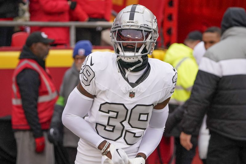 Dec 25, 2023; Kansas City, Missouri, USA; Las Vegas Raiders cornerback Nate Hobbs (39) runs onto the field against the Kansas City Chiefs prior to a game at GEHA Field at Arrowhead Stadium. Mandatory Credit: Denny Medley-USA TODAY Sports