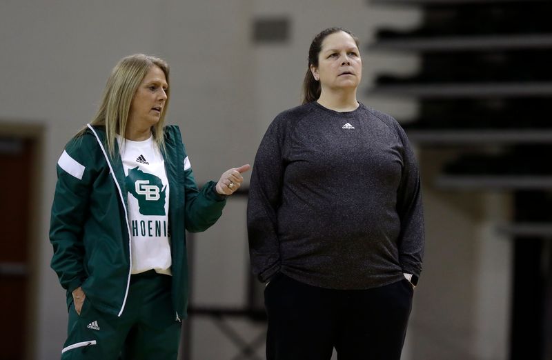 Former UWGB assistant Kate Peterson Abiad, left, is the new coach at Purdue Fort Wayne.