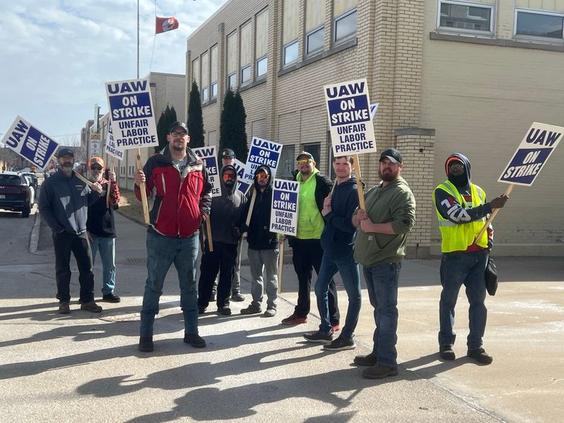 United Auto Workers union members picket outside Cummins in Oshkosh, Wisconsin, Tuesday, March 18, 2025.