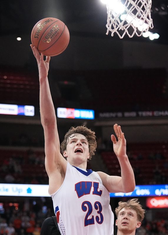 Wisconsin Lutheran's Zavier Zens (23) puts his team ahead, 56-55, in the final minute of the WIAA Division 1 state championship game against Marshfield, Saturday, March 22, 2025, at the Kohl Center in Madison, Wis. Wisconsin Lutheran won the game, 57-55.