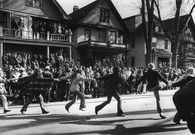 Taunting police, a line of young dancers swung from the sidewalk into Mifflin Street as they joined in an afternoon block party in the Madison hippie community in 1971. Police tried to keep the youths on the sidewalk. Ronald Overdahl / Milwaukee Journal Sentinel