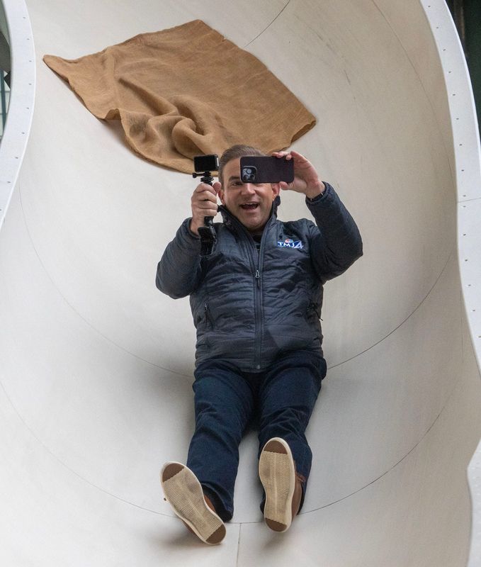 WTMJ-TV (Channel 4) morning news anchor Tom Durian slides down Bernie’s Chalet slide at American Family Field in Milwaukee on March 28, 2025. Durian, who has been with the Milwaukee NBC affiliate since 2017, is leaving the station at the end of July 2025.