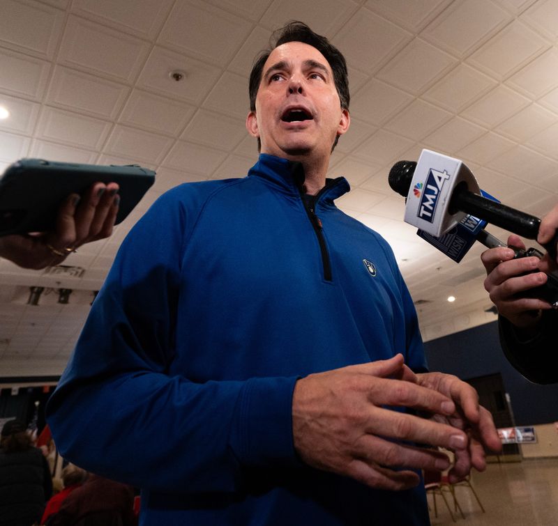 Former Wisconsin Governor Scott Walker speaks to the press as Wisconsin Supreme Court candidate and Waukesha County Judge Brad Schimel is scheduled to speak at a “Save the Court Rally” hosted by the Republican Party of Milwaukee County on Saturday March 29, 2025 at American Serb Hall in Milwaukee, Wis.