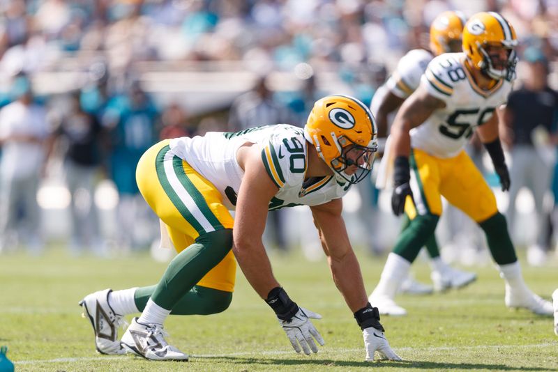 Oct 27, 2024; Jacksonville, Florida, USA; Green Bay Packers defensive lineman Lukas Van Ness (90) waits for the snap against the Jacksonville Jaguars during the second quarter at EverBank Stadium. Mandatory Credit: Morgan Tencza-Imagn Images