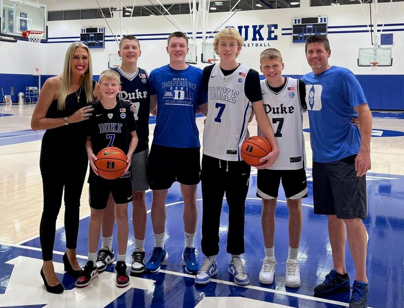 Former UWGB star Chari Nordgaard-Knueppel has spent all winter traveling to watch her five sons play basketball. Chari is pictured with her kids and husband. From left to right, Chari, Kidman, Kinston, Kon II, Kager, Kash and husband Kon.