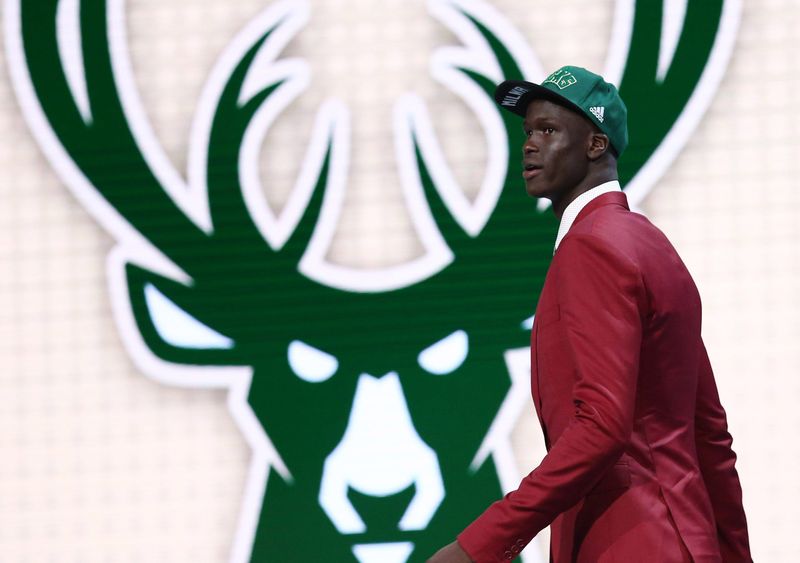 Thon Maker walks off stage after being selected as the No. 10 overall pick to the Milwaukee Bucks in the first round of the 2016 NBA Draft.