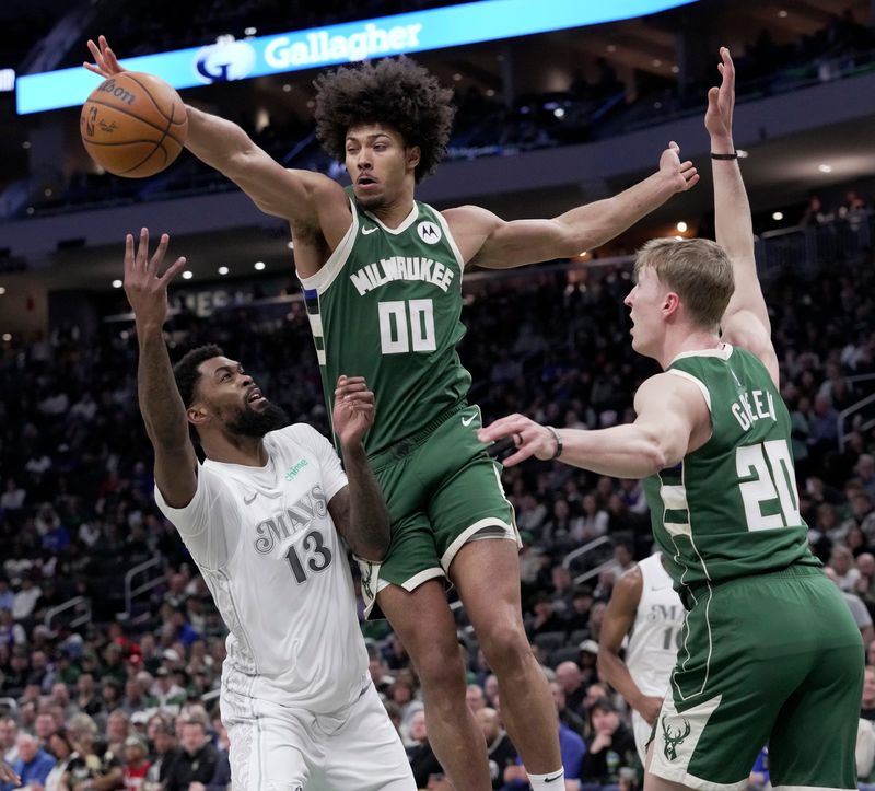 Milwaukee Bucks center Jericho Sims (00) blocks a shot by Dallas Mavericks forward Naji Marshall (13) during the first half of their game Wednesday, March 5, 2025 at Fiserv Forum in Milwaukee, Wisconsin.