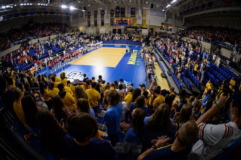 Fans stand for the national anthem before a women's college volleyball match between Marquette and Wisconsin on Sunday, September 12, 2021, at the Al McGuire Center in Milwaukee, Wisconsin.