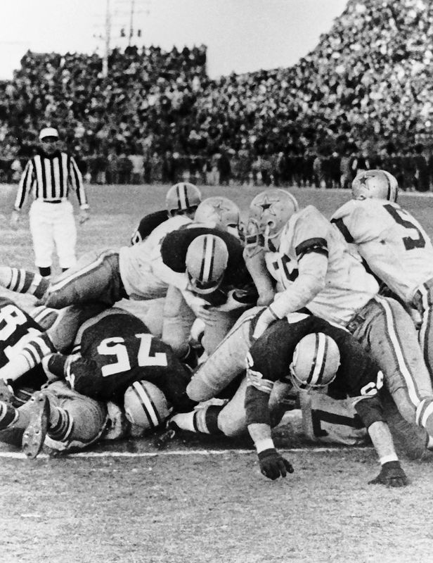 Green Bay Packers quarterback Bart Starr scores the winning touchdown in the NFL Championship game on Dec. 31, 1967, at Lambeau Field in Green Bay, Wis. The Packers defeated the Dallas Cowboys 21-17. At minus-13 degrees, with a minus-48 wind chill, the Ice Bowl remains the NFL's coldest game ever.