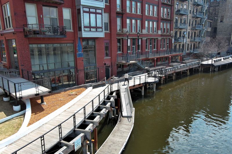 The RiverWalk runs alongside Blue Bat Kitchen in Milwaukee's Third Ward, pictured on Friday, April 11, 2025.