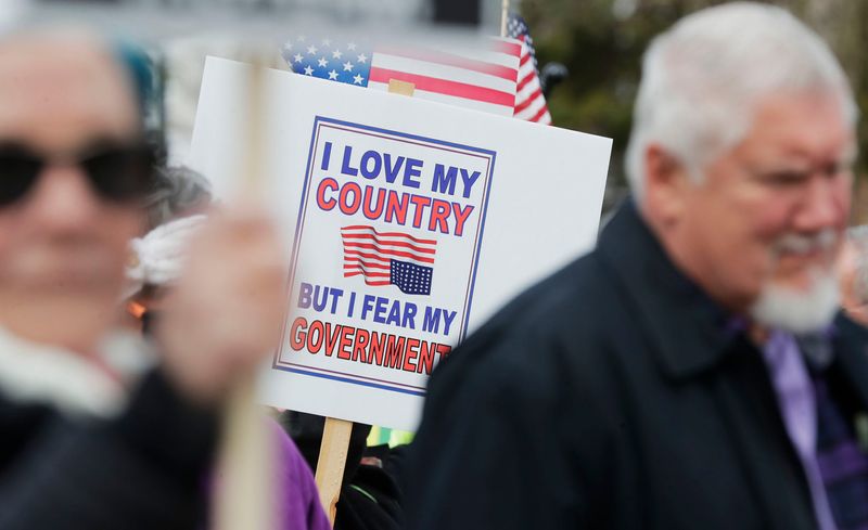 A sign at the anti-Donald Trump demonstration at Washington Park, Saturday, April 19, 2025, in Manitowoc, Wis.