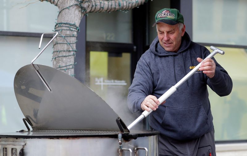 Chef Ken Goffard stirs a kettle of booyah during Downtown Green Bay Inc.'s inaugural Booyah Battle in 2025 as part of NFL draft weekend. The event is returning April 25 as part of the Washington Street Block Party.
