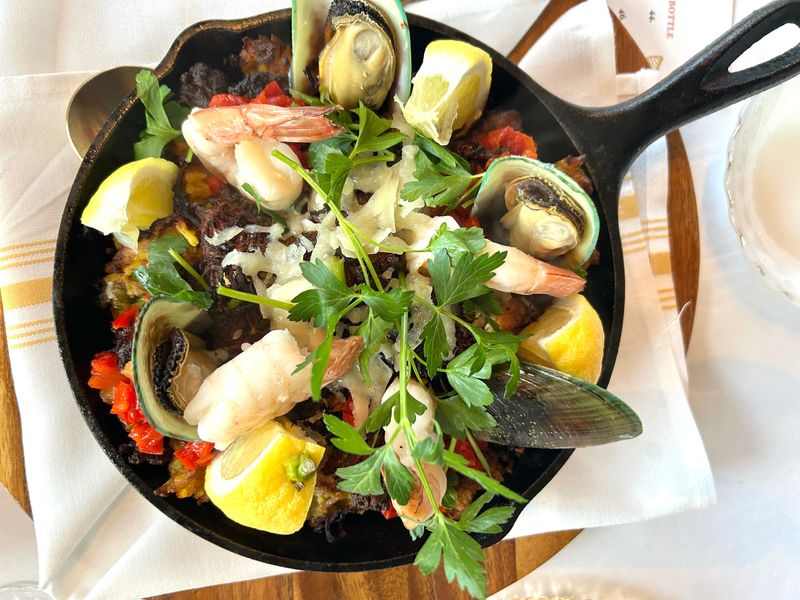 The Mixta paella at Cavas, 401 E. Erie St., is a surf-and-turf mix with chicken, chorizo, roasted pork, mussels and shrimp.
