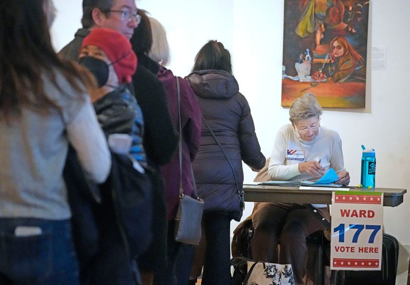An election inspector checks in voters at the Charles Allis Art Museum at 1801 N. Prospect Ave. in Milwaukee on Tuesday, April 1, 2025 at wards 177 and 176. Admission to the museum was free today on election day.