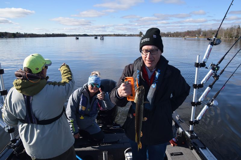 Gov. Tony Evers holds a 19-inch-long northern pike he caught May 3, 2025 while fishing with Barb Carey and Rikki Pardun on Rice Lake as part of the 2025 Governor's Fishing Opener. The fish was released.