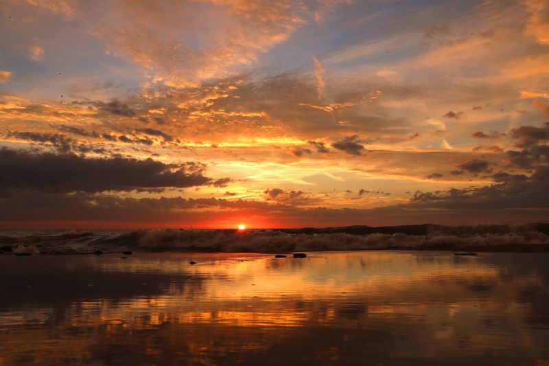 The sunrise over Lake Michigan near Doctors Park in Fox Point Wisconsin.