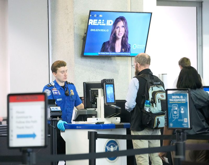 A passenger makes their way through TSA security screening at Milwaukee Mitchell International Airport in Milwaukee on Wednesday, May 7, 2025. Starting May 7, everyone 18 and older is required to have a REAL ID to fly domestically or enter federal buildings.