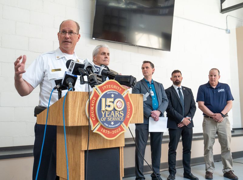 Milwaukee Fire Chief Aaron Lipski, left, makes remarks regarding the Highland Court Apartments fatal fire at a press conference on May 13, 2025, in Milwaukee. Lipski earned a new four-year term as the city's fire chief.