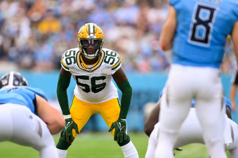 Sep 22, 2024; Nashville, Tennessee, USA; Green Bay Packers linebacker Edgerrin Cooper (56) sneaks a peak into the backfield against the Tennessee Titans during the first half at Nissan Stadium. Mandatory Credit: Steve Roberts-Imagn Images
