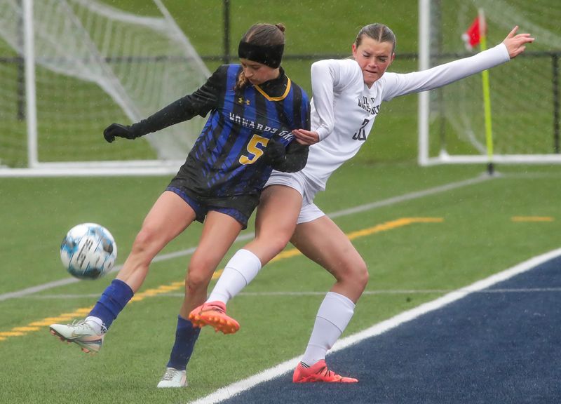 Howards Grove’s Kendall Holzwart (5) and Ozaukee/Random Lake’s Layla Wisniewski (30) battle for the ball, Tuesday, May 20, 2025, at Lakeland University near Plymouth, Wis.
