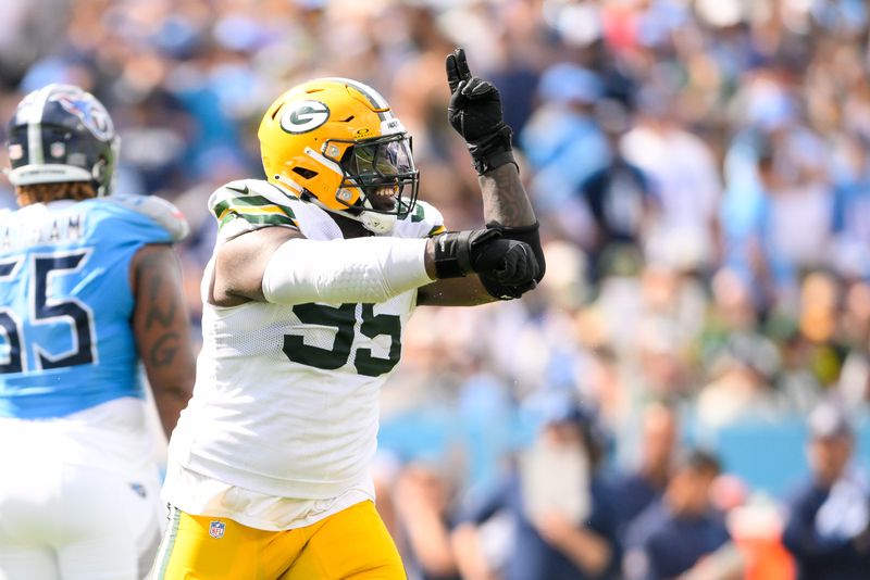 Sep 22, 2024; Nashville, Tennessee, USA; Green Bay Packers defensive tackle Devonte Wyatt (95) celebrates his sack of Tennessee Titans quarterback Will Levis (8) during the second half at Nissan Stadium. Mandatory Credit: Steve Roberts-Imagn Images