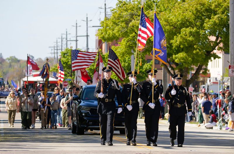 The Sheboygan Police color guard marches in the Sheboygan Memorial Day parade, Monday, May 26, 2025, in Sheboygan, Wis.