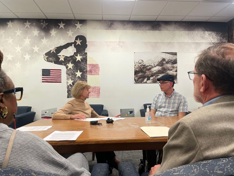 U.S. Sen. Tammy Baldwin meets with three veterans and a retired VA medical doctor on May 27 at Dry Hootch in Madison to discuss job reductions at VA hospitals and clinics across Wisconsin and the country.