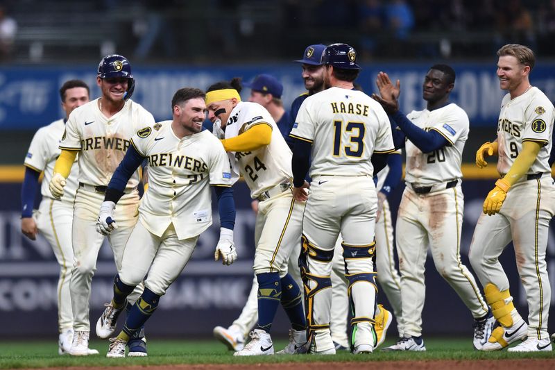 May 28, 2025; Milwaukee, Wisconsin, USA; Milwaukee Brewers third baseman Caleb Durbin (21) celebrates with teammates after the victory over the Boston Red Sox at American Family Field. Mandatory Credit: Patrick Gorski-Imagn Images
