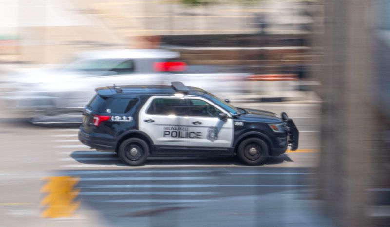 A Milwaukee Police car travels across Vel R. Phillips Avenue along West State Street in Milwaukee on June 3, 2025.