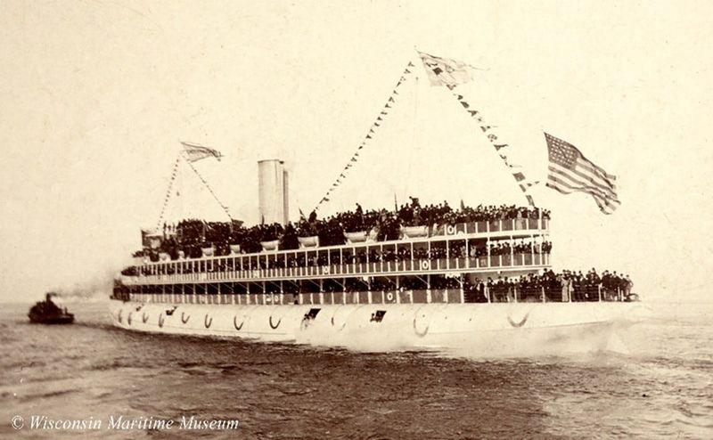 Port view of whaleback passenger steamer SS Christopher Columbus on maiden voyage loaded with passengers in 1893.