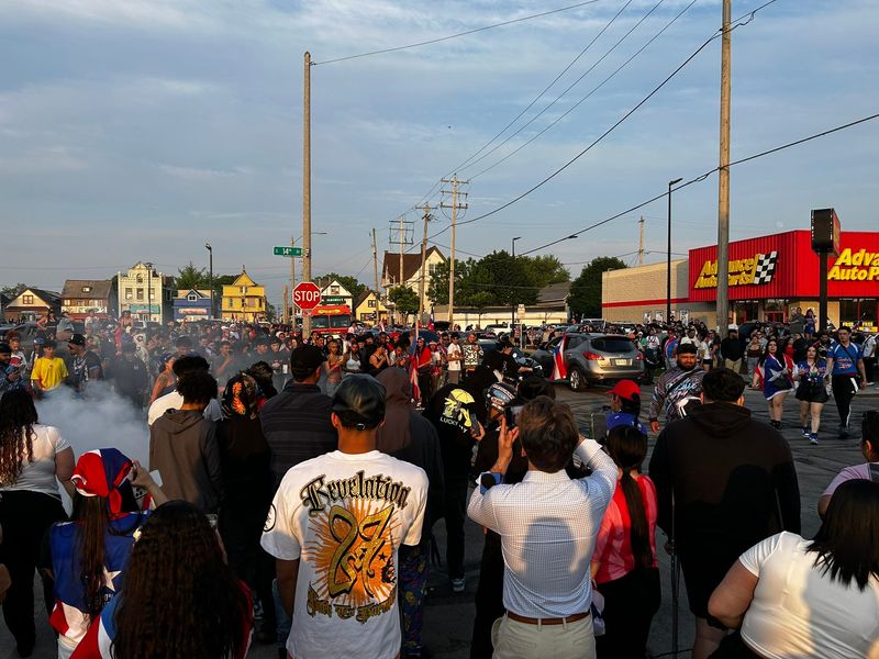 A large crowd blocks an intersection at 14th and Burnham Streets on June 8 for a street takeover following a Puerto Rican Day Festival and Parade at Mitchell Park. Police began dispersing the event around 8 p.m.