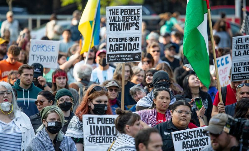 Anti-ICE protesters gather around at Cathedral Square Park in Milwaukee on June 10, 2025.