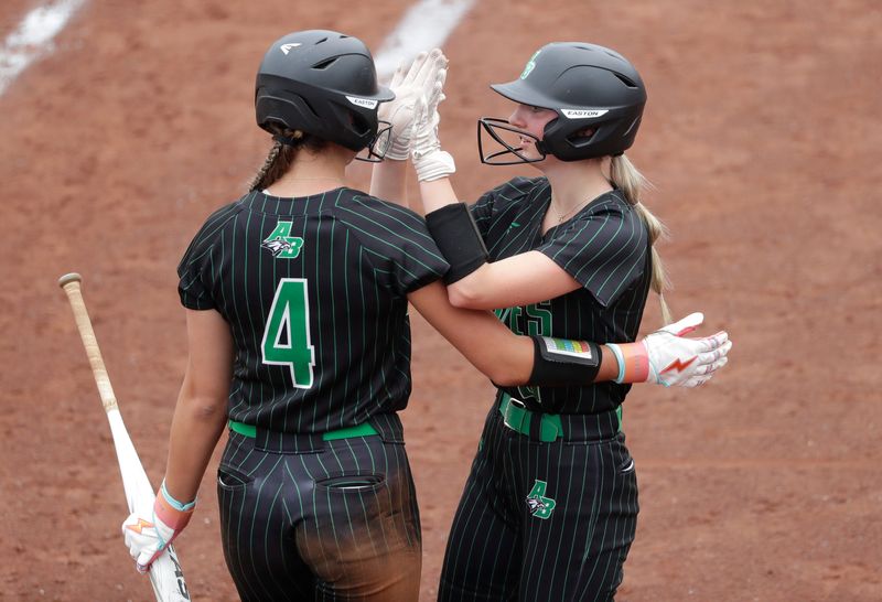 Almond-Bancroft High School's Mya Dernbach (4) is congratulated by Aaliyah Newby (8) after scoring a run against Thorp High School during their WIAA Division 5 semifinal softball game Thursday, June 12, 2025, at the Goodman Softball Complex in Madison, Wisconsin. Almond-Bancroft won 18-3.
Dan Powers/USA TODAY NETWORK-Wisconsin.
