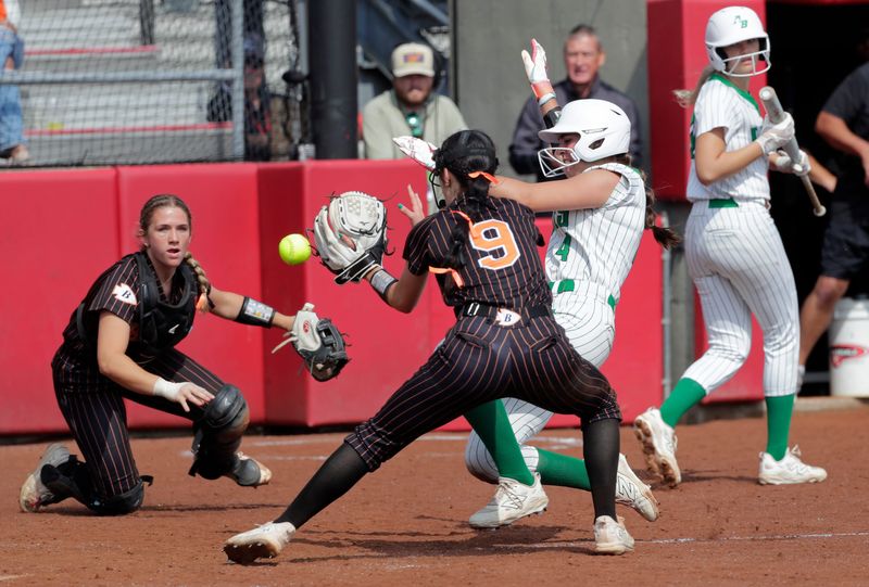 Almond-Bancroft High School's Mya Dernbach (4) scores a run against Belmont High School's Carsyn Ramaker (9) during their WIAA Division 5 championship softball game Saturday June 14, 2025, at the Goodman Softball Complex in Madison, Wisconsin. Almond-Bancroft lost 8-3.
Dan Powers/USA TODAY NETWORK-Wisconsin.