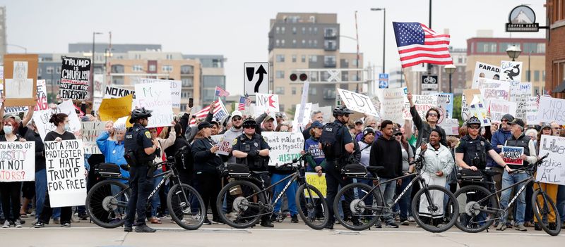 Protesters gather to voice their concerns about President Donald Trump for "No Kings Day" on June 14, 2025, along North Broadway in Green Bay, Wis.