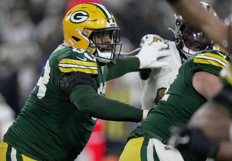 Green Bay Packers offensive tackle Rasheed Walker (63) provides pass protection during the third quarter of their game Monday, December 23, 2024 at Lambeau Field in Green Bay, Wisconsin. The Green Bay Packers beat the New Orleans Saints 34-0.