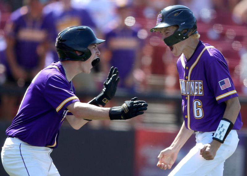 Kewaunee's Connor Kilgore (6) and Ethan Paplham (9) celebrate during a three-run fifth inning against Fennimore in a WIAA Division 3 state semifinal. Kewaunee won 5-3.