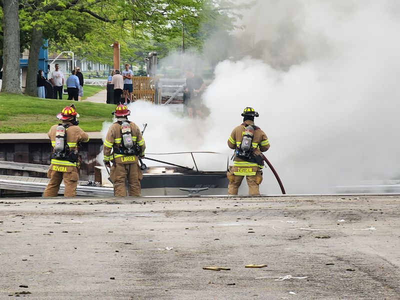 Manitowoc fire fighters responded to a small boat that had caught fire in the water at the Manitowoc Marina June 18.