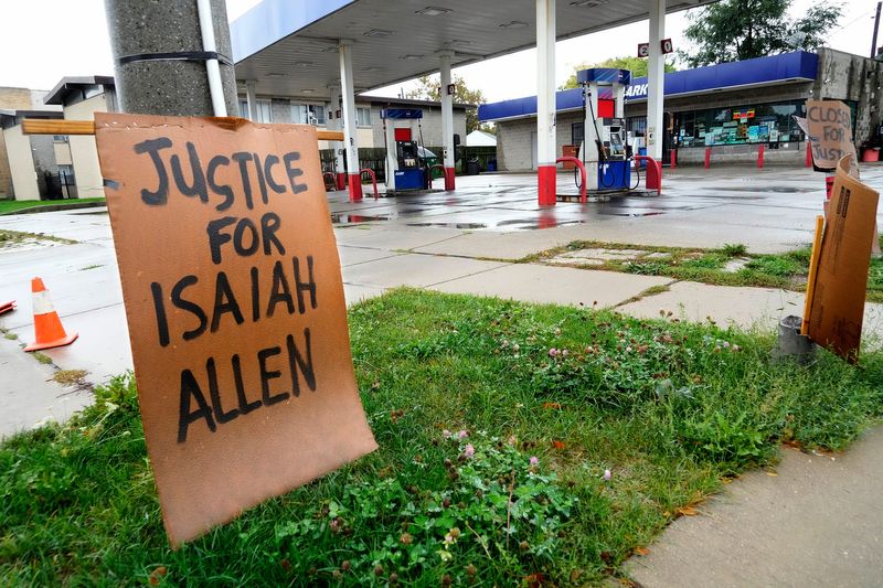 Signs are posted outside the Teutonia Gas & Food gas station at 4295 N. Teutonia Avenue in Milwaukee on Wednesday, Sept. 27, 2023, where Isaiah Allen was shot and killed in August by a security guard. Since then, members of his family and the community have camped outside the business to ensure it won't open again and have pushed city officials to pull its license. A city committee recommended to pull the license last week. The Common Council will take a final vote Oct. 10.