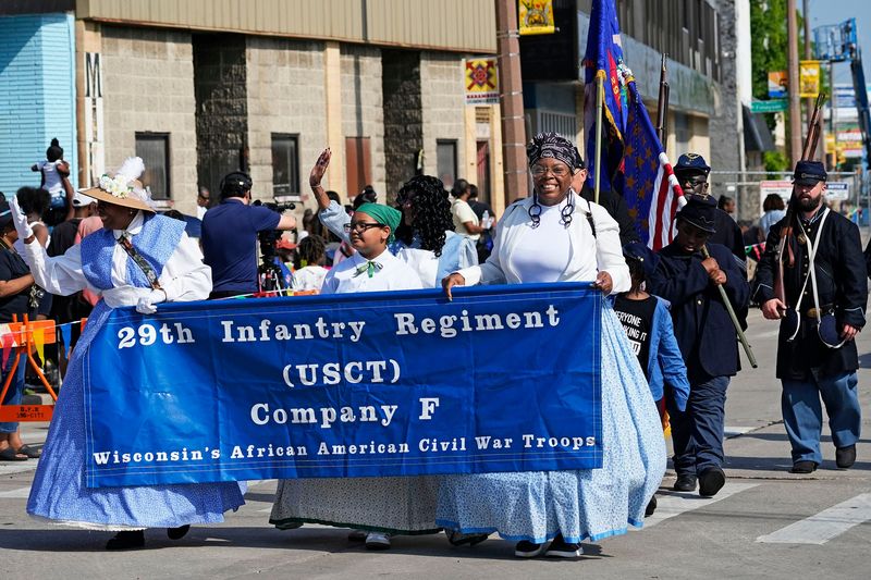 Members from the 29th Infantry Regiment USCT Company F lead the start of the Milwaukee's 2025 Juneteenth celebration down Martin Luther King Jr., Drive on Thursday, June 19, 2025 in Milwaukee.