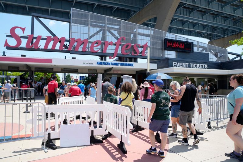 People enter shortly after the gates open during the opening day of Summerfest at Maier Festival Park in Milwaukee on June 19, 2025. Summerfest 2025 takes place June 19-21, June 26-28 and July 3-5.